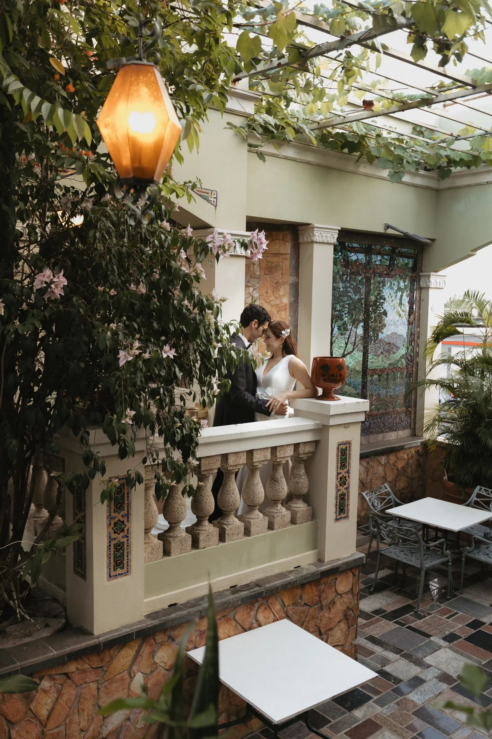 Wedding venue archway and balcony strung with string lights