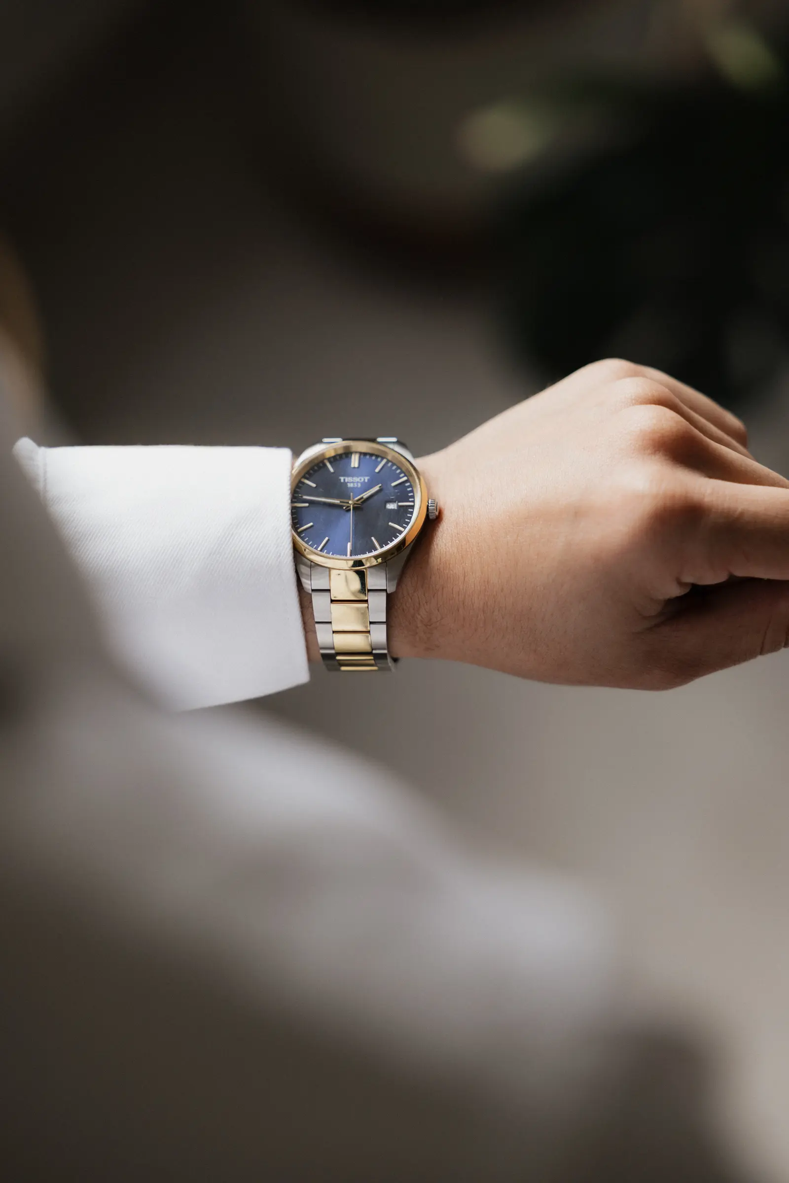 Close-up of the groom's wristwatch as he gets ready
