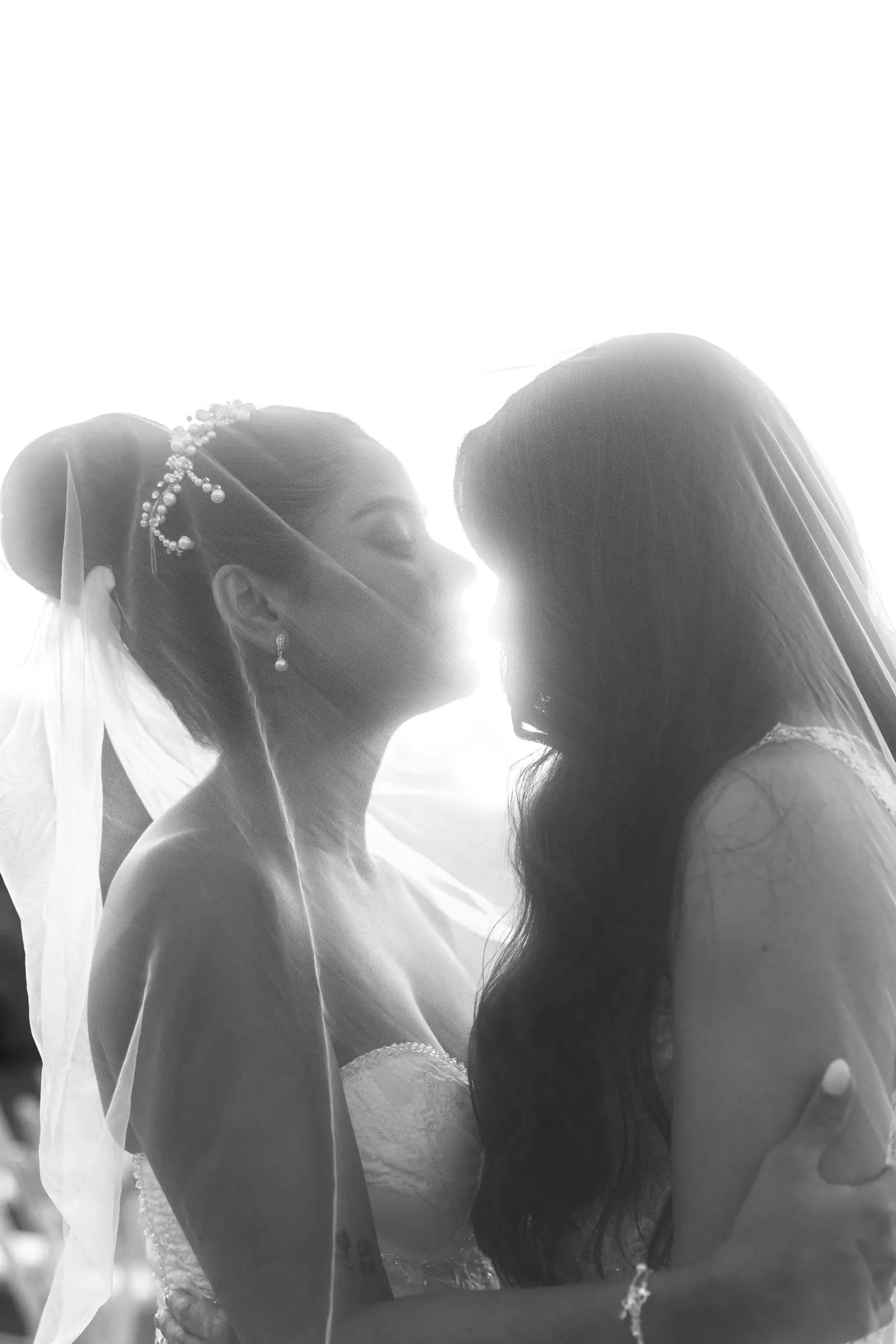 Bride and bridesmaid sharing a moment